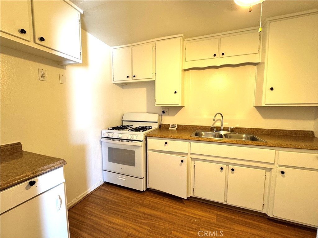 36528 Irwin Road Barstow, CA 92311 - Photo 17 of 35 a kitchen with stainless steel appliances white cabinets and a sink