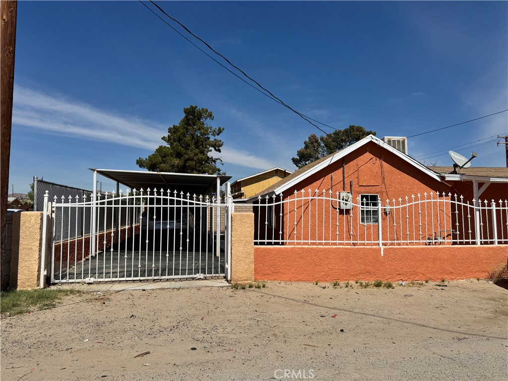 36528 Irwin Road Barstow, CA 92311 - Photo 29 of 35 a view of a house with wooden fence