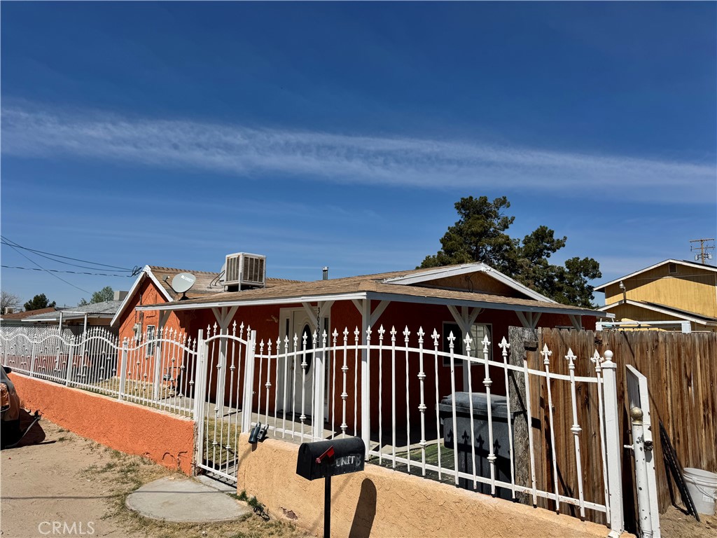 36528 Irwin Road Barstow, CA 92311 - Photo 3 of 35 a front view of a house with wooden fence