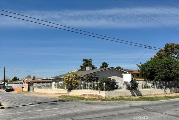 a view of a backyard of the house