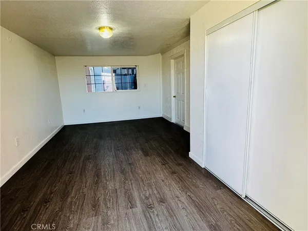 a view of a livingroom with wooden floor