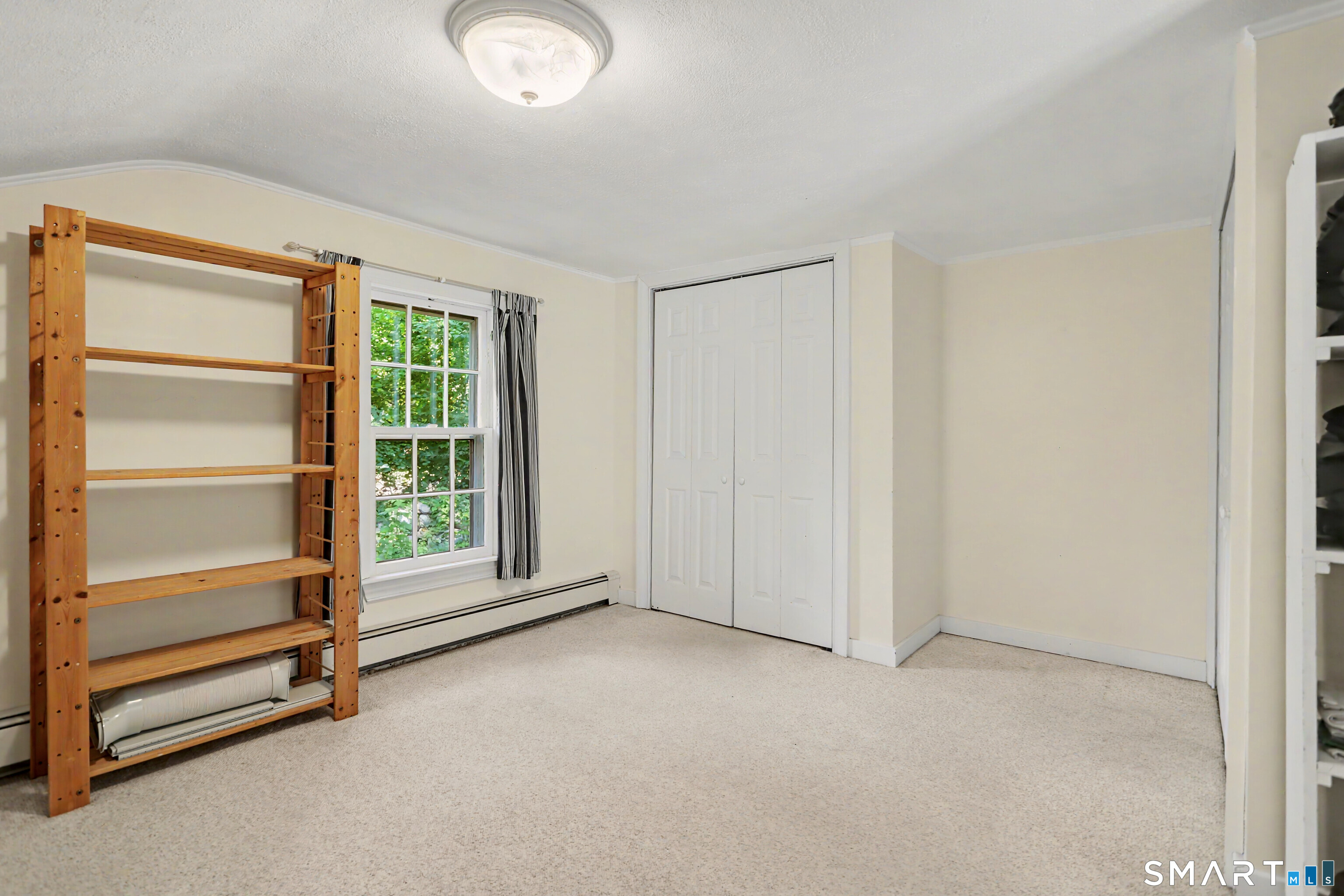 31 Vista Road Wilton, CT 06897 - Photo 15 of 34 Thoughtfully positioned off the primary bedroom, this bonus space includes laundry and extensive storage, adding convenience and versatility to everyday living.