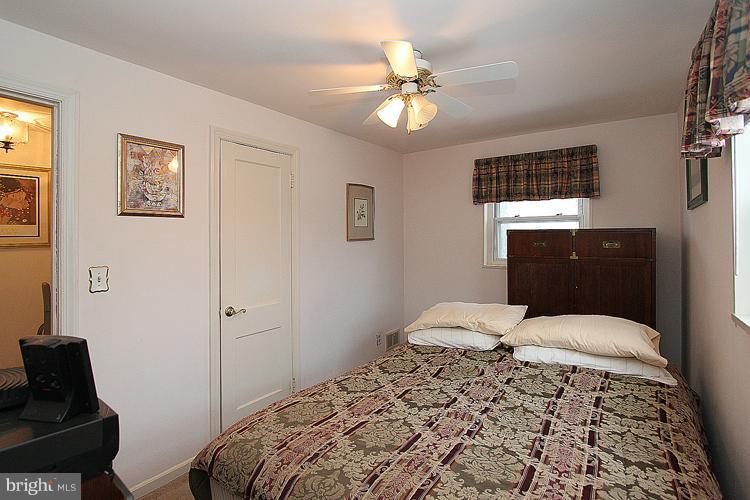 11942 Bluhill Road Silver Spring, MD 20902 - Photo 13 of 30 a bedroom with a bed and window