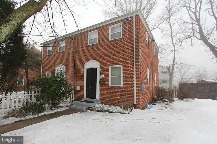 11942 Bluhill Road Silver Spring, MD 20902 - Photo 16 of 30 a front view of a house with a yard