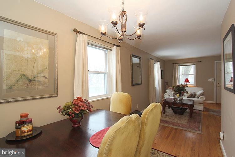 11942 Bluhill Road Silver Spring, MD 20902 - Photo 23 of 30 a living room with furniture and flowers