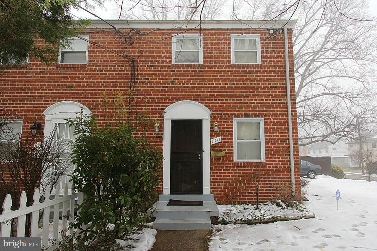11942 Bluhill Road Silver Spring, MD 20902 - Photo 30 of 30 a front view of a house with garden