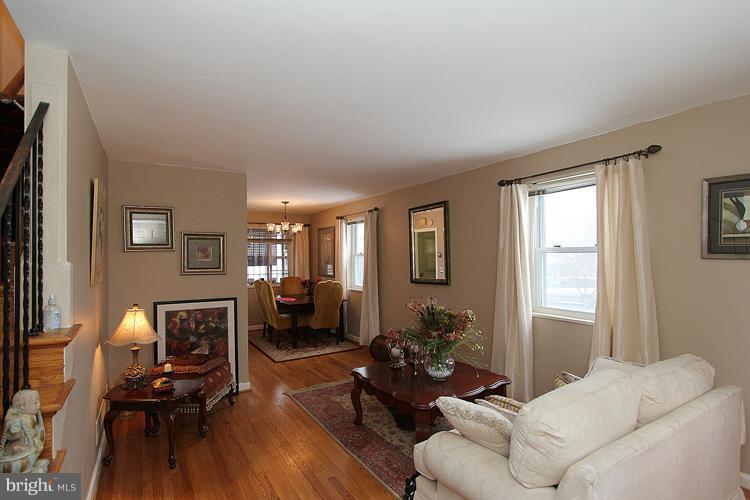 11942 Bluhill Road Silver Spring, MD 20902 - Photo 4 of 30 a living room with furniture window and wooden floor
