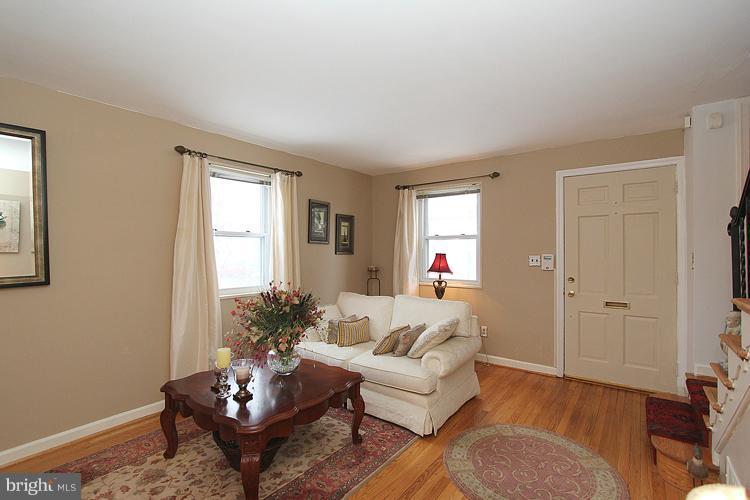 11942 Bluhill Road Silver Spring, MD 20902 - Photo 9 of 30 a living room with furniture and wooden floor