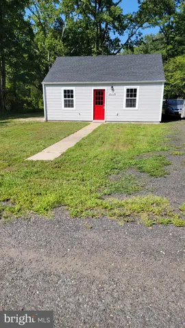 a house view with a backyard space