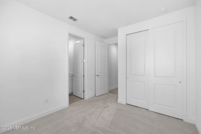 a bathroom with a granite countertop sink a toilet and bathtub