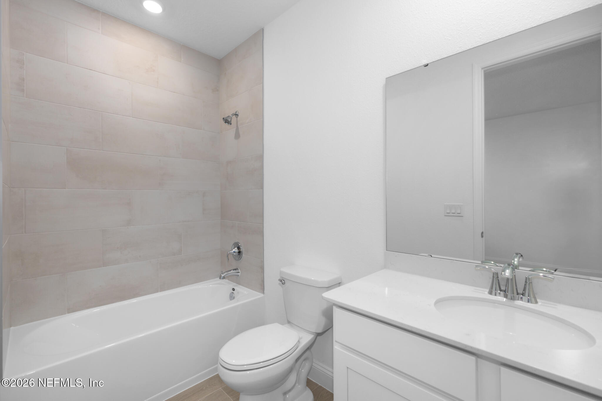 299 Pentwater Road St. Augustine, FL 32092 - Photo 12 of 25 a bathroom with a granite countertop sink a toilet and bathtub