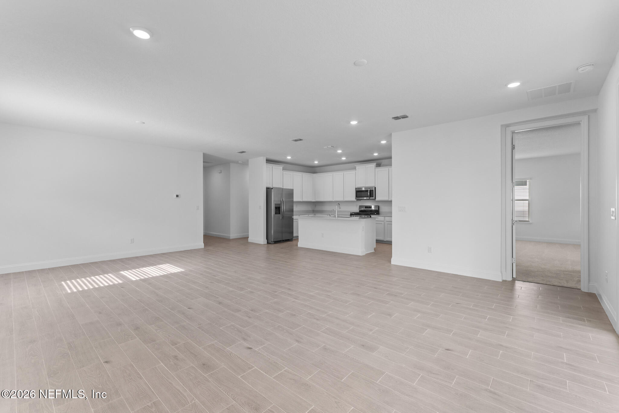 299 Pentwater Road St. Augustine, FL 32092 - Photo 15 of 25 a view of a kitchen with a sink and a refrigerator