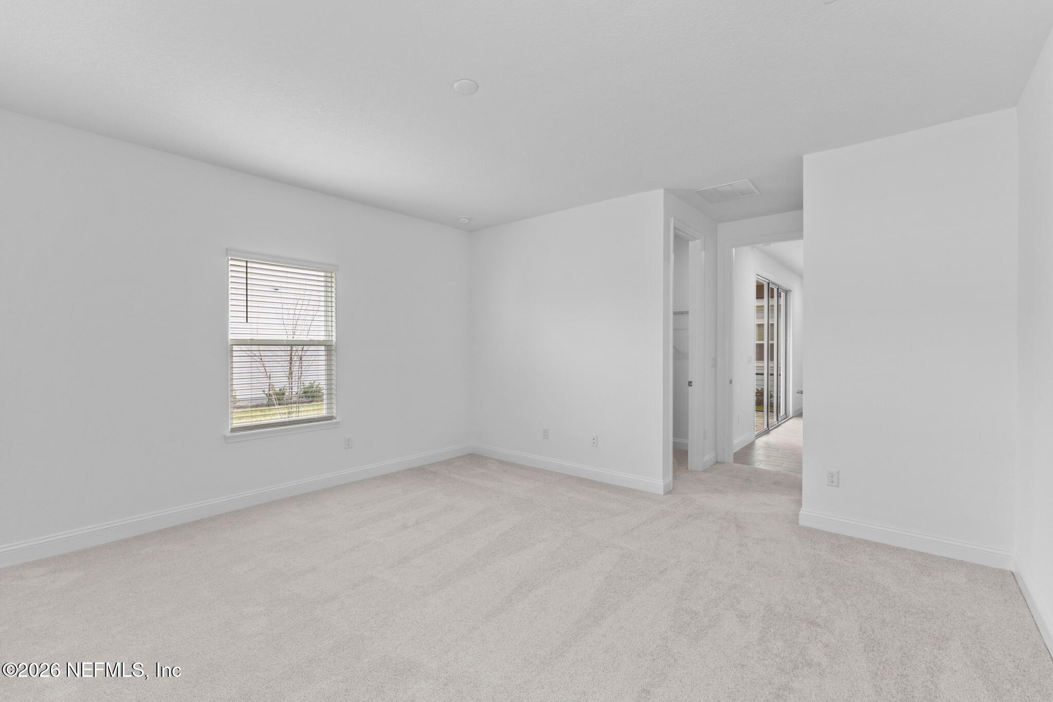 299 Pentwater Road St. Augustine, FL 32092 - Photo 20 of 25 a view of an empty room with a window