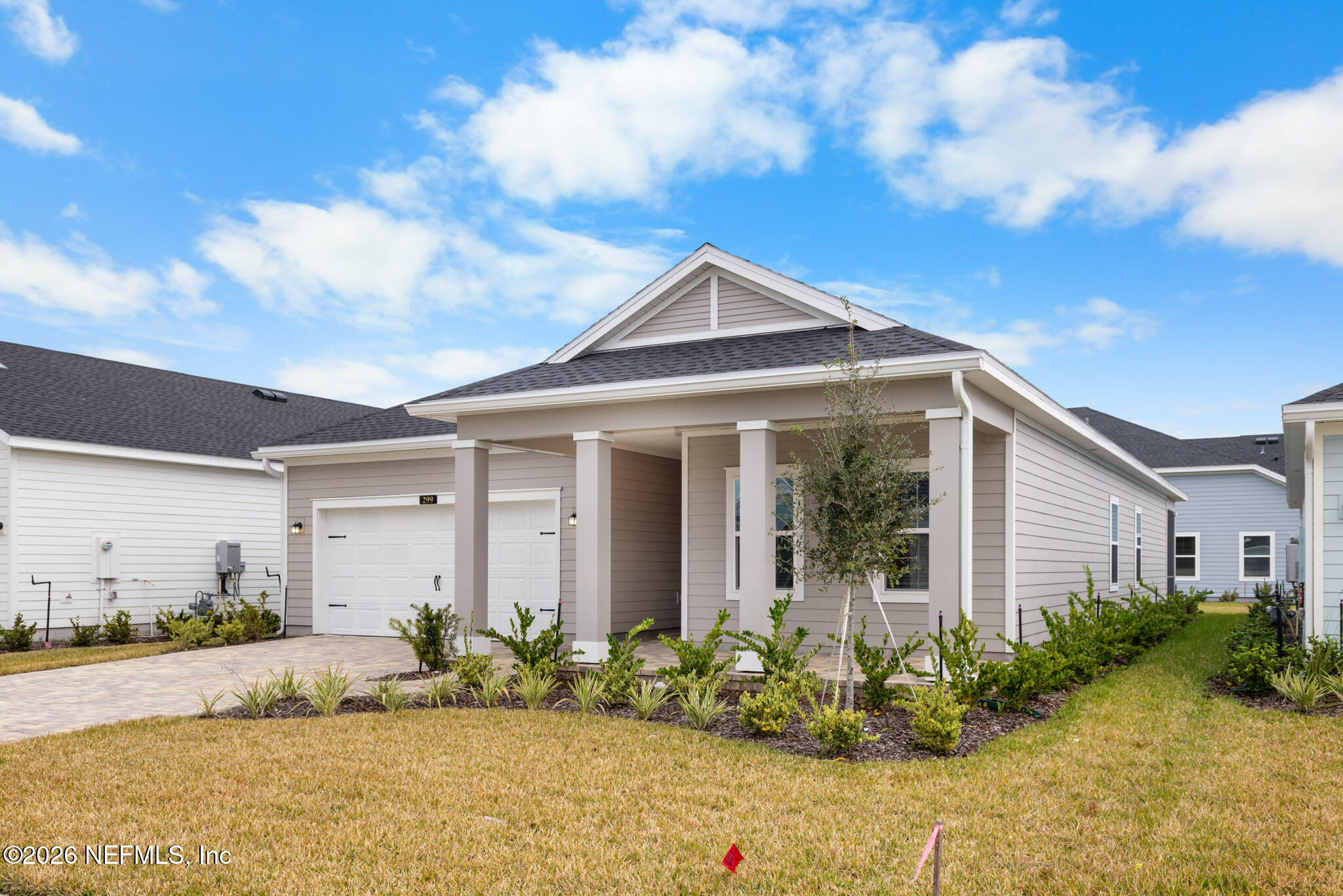 299 Pentwater Road St. Augustine, FL 32092 - Photo 2 of 25 a front view of a house with a garden