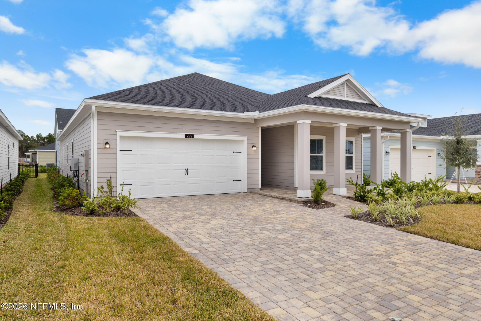 299 Pentwater Road St. Augustine, FL 32092 - Photo 3 of 25 a front view of a house with a yard and garage