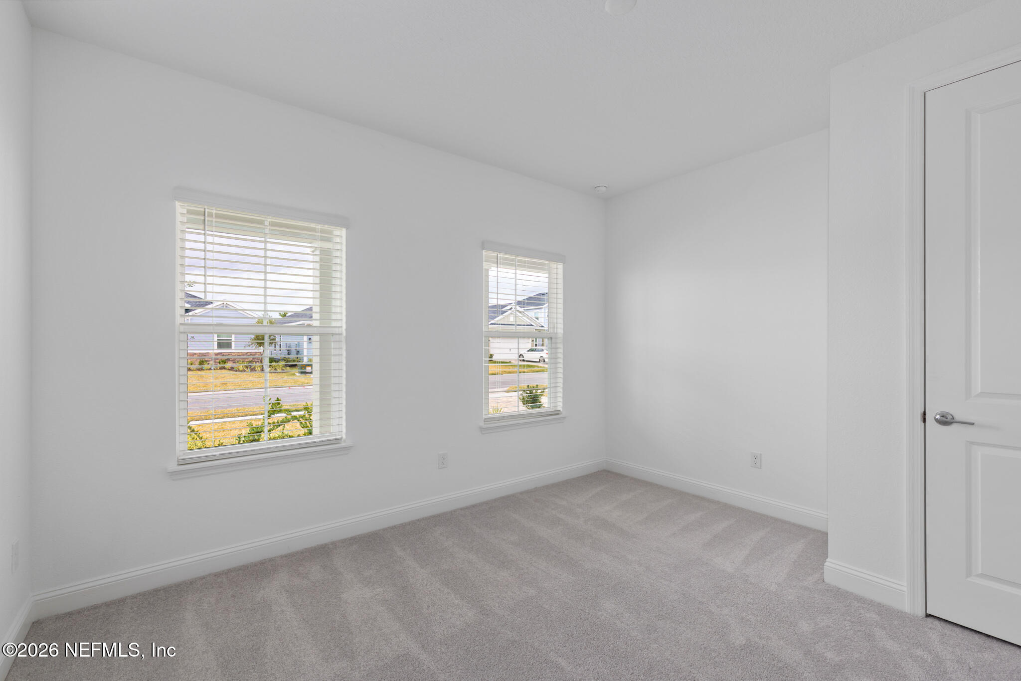 299 Pentwater Road St. Augustine, FL 32092 - Photo 5 of 25 a view of an empty room with a window