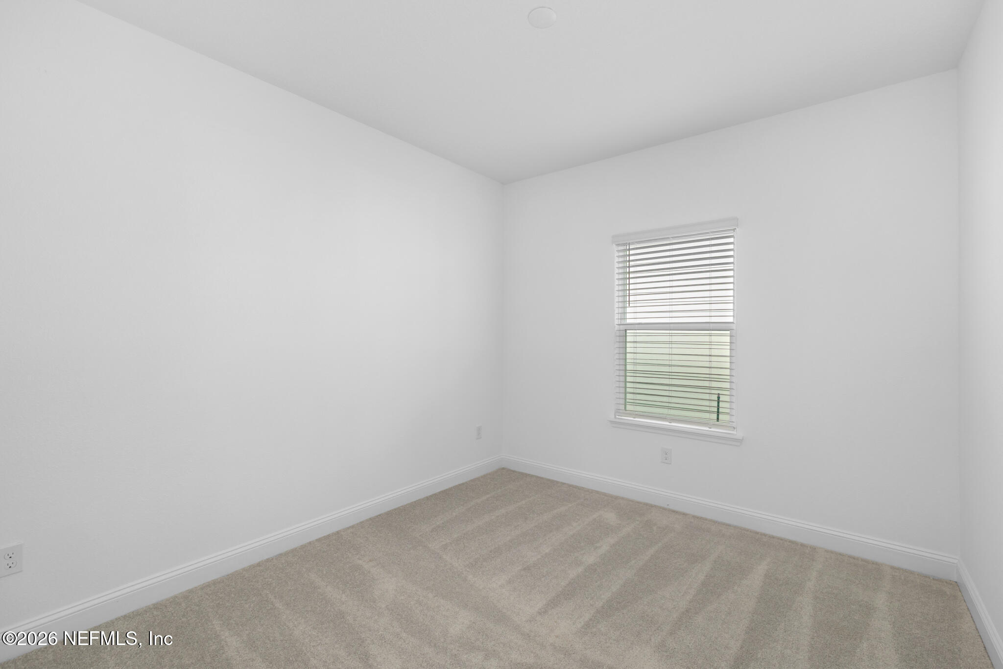 299 Pentwater Road St. Augustine, FL 32092 - Photo 10 of 25 an empty room with a window