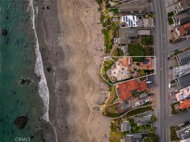 a living room with fireplace furniture and a large window