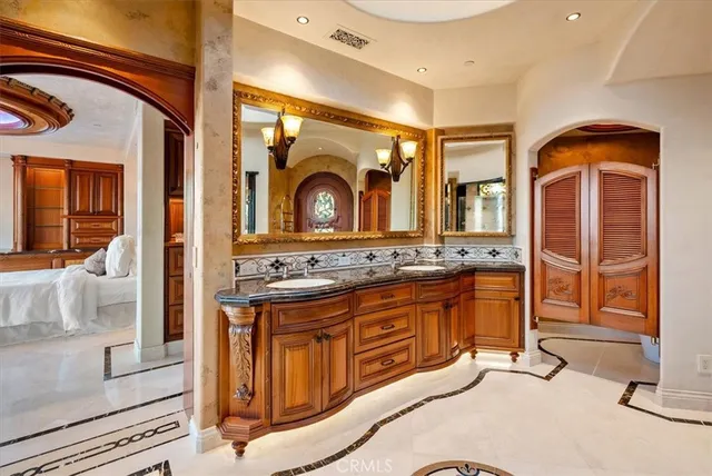 a vase of flowers sitting on a wooden floor