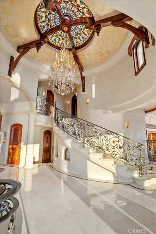 an aerial view of a house with a swimming pool