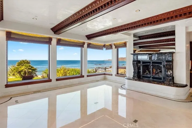 a kitchen with stainless steel appliances granite countertop a sink and a refrigerator