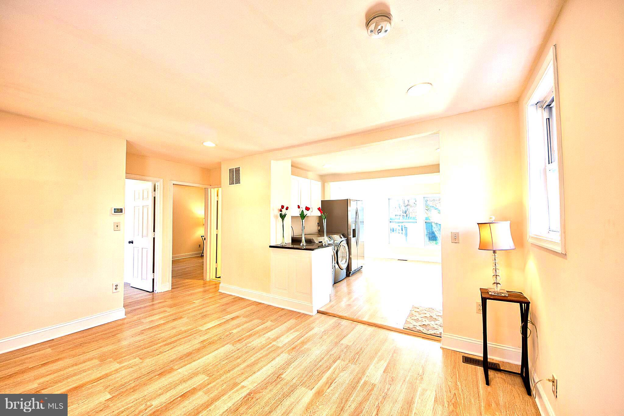 305 Poplar Road Baltimore, MD 21221 - Photo 22 of 25 a view of a living room and a bathroom