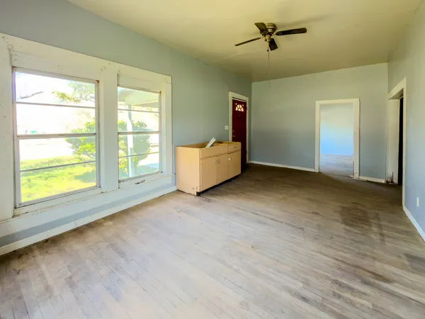 a view of an empty room with a window