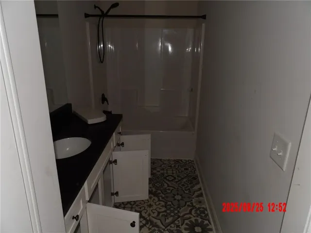 a bathroom with a sink and toilet