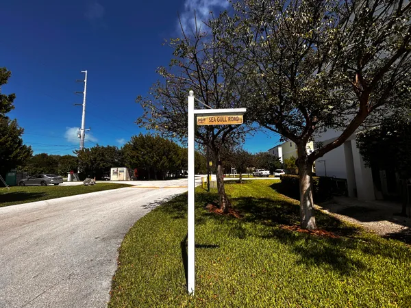 a view of a sign in front of house