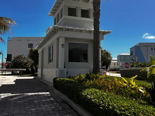 a view of a house with large windows