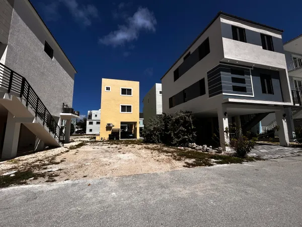 a view of a house with a snow in front of house
