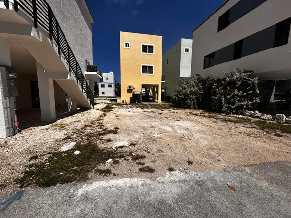 a view of a yard with an ocean