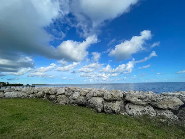 a backyard of a house with yard and outdoor seating