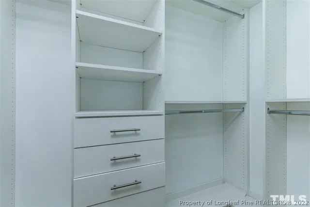 a view of an empty walk in closet