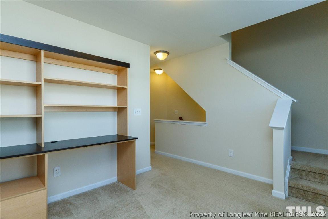 110 Mt Evans Drive Durham, NC 27705 - Photo 20 of 27 a view of an empty room with cabinet and a window