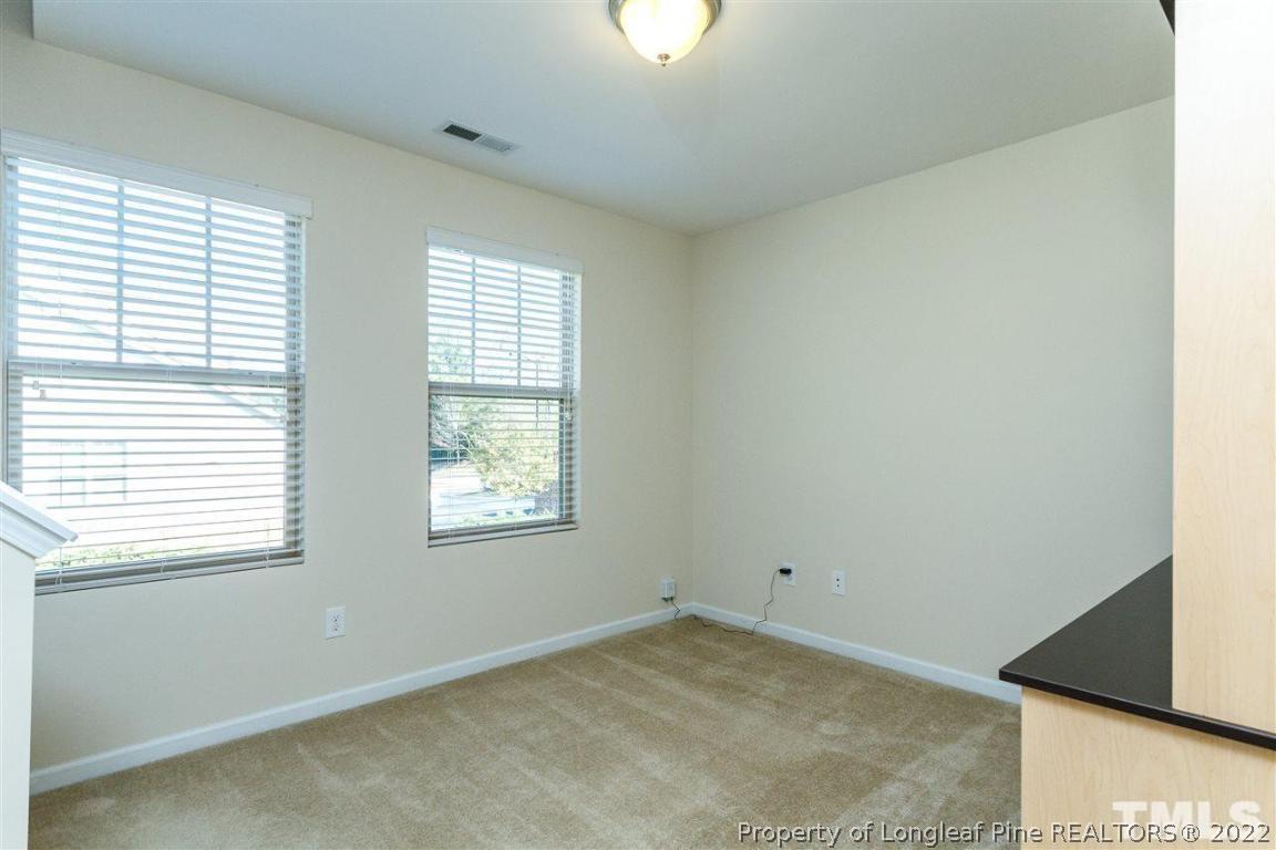 110 Mt Evans Drive Durham, NC 27705 - Photo 21 of 27 an empty room with a window