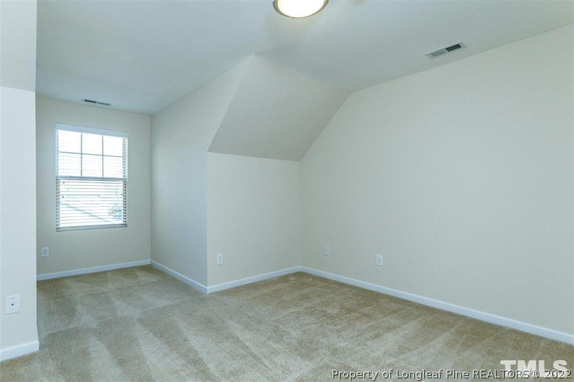 110 Mt Evans Drive Durham, NC 27705 - Photo 22 of 27 an empty room with a window