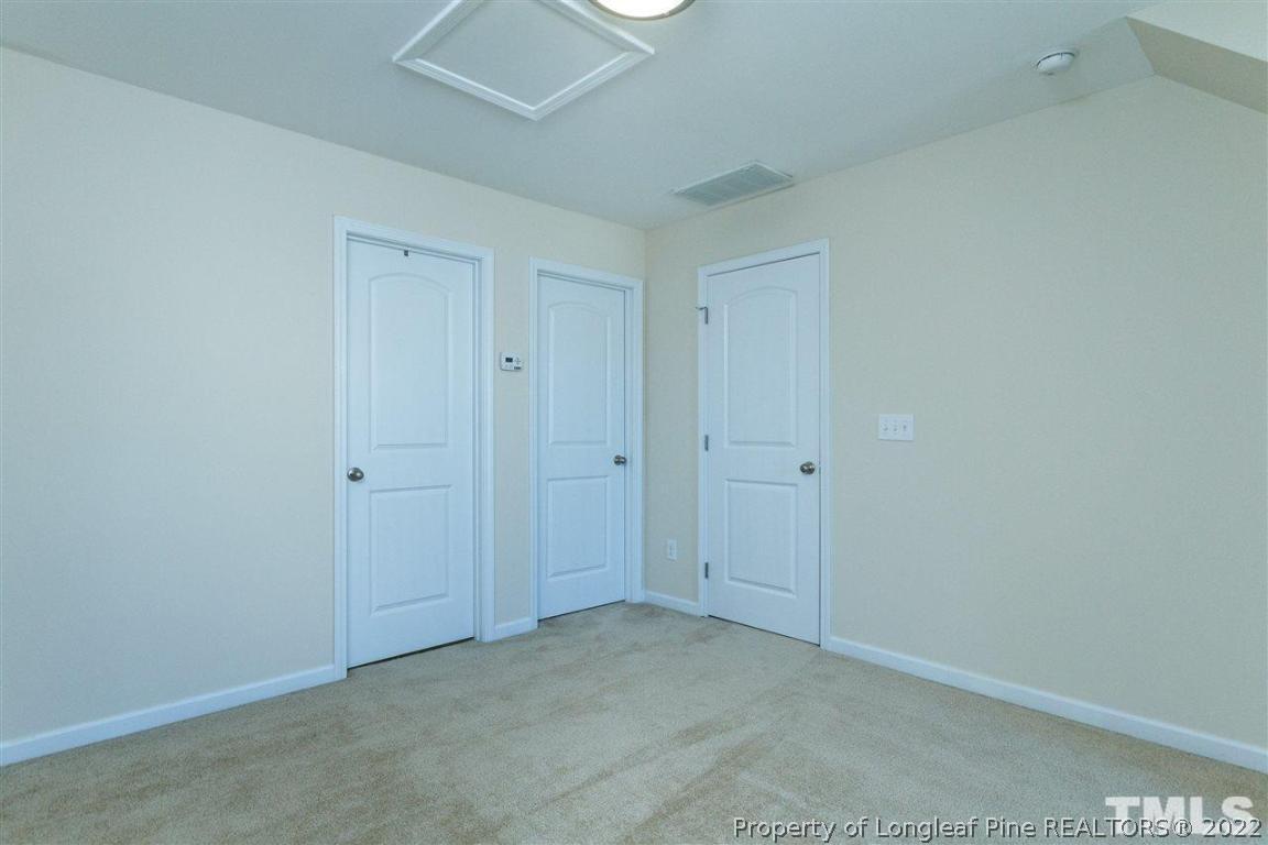 110 Mt Evans Drive Durham, NC 27705 - Photo 23 of 27 a view of an empty room