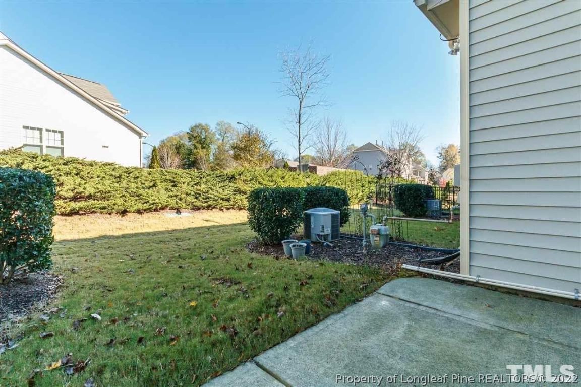 110 Mt Evans Drive Durham, NC 27705 - Photo 26 of 27 a view of a chair and table in backyard