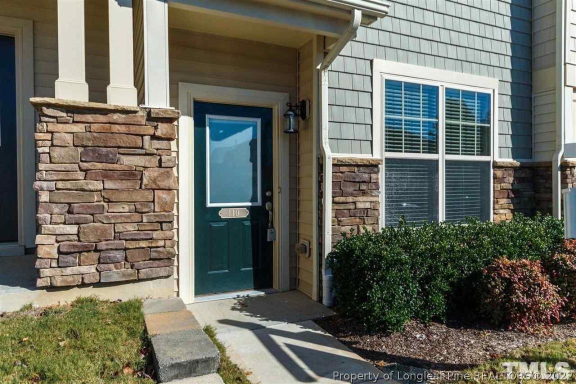 110 Mt Evans Drive Durham, NC 27705 - Photo 3 of 27 a front view of a house with a garden