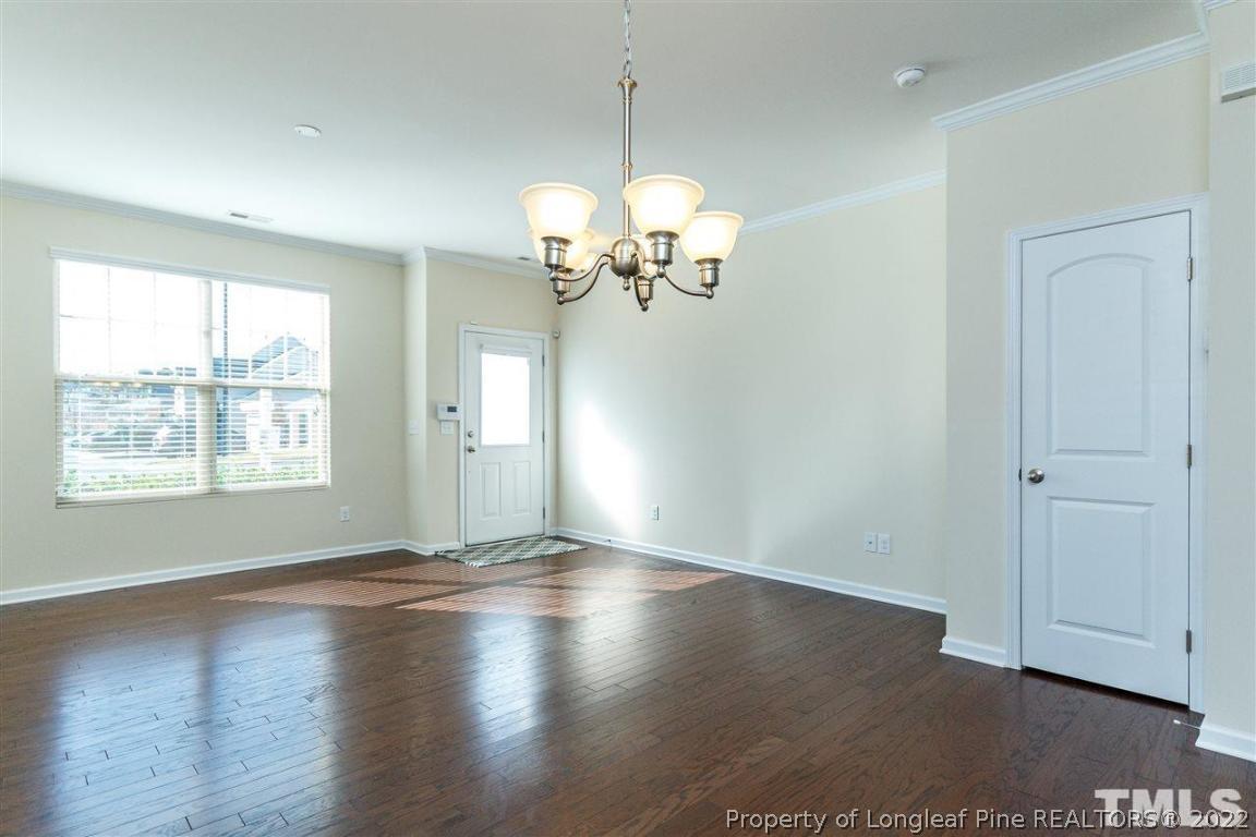 110 Mt Evans Drive Durham, NC 27705 - Photo 5 of 27 a view of a room with wooden floor and a window