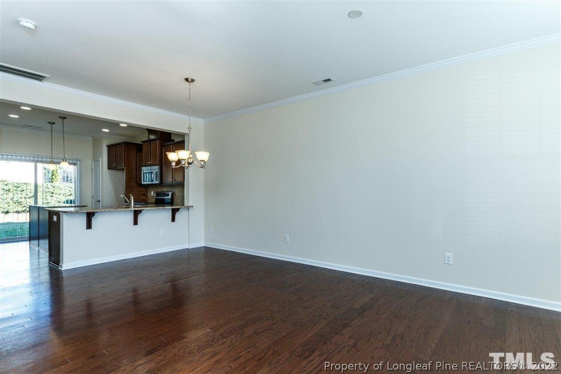 110 Mt Evans Drive Durham, NC 27705 - Photo 8 of 27 a view of a room with wooden floor and furniture