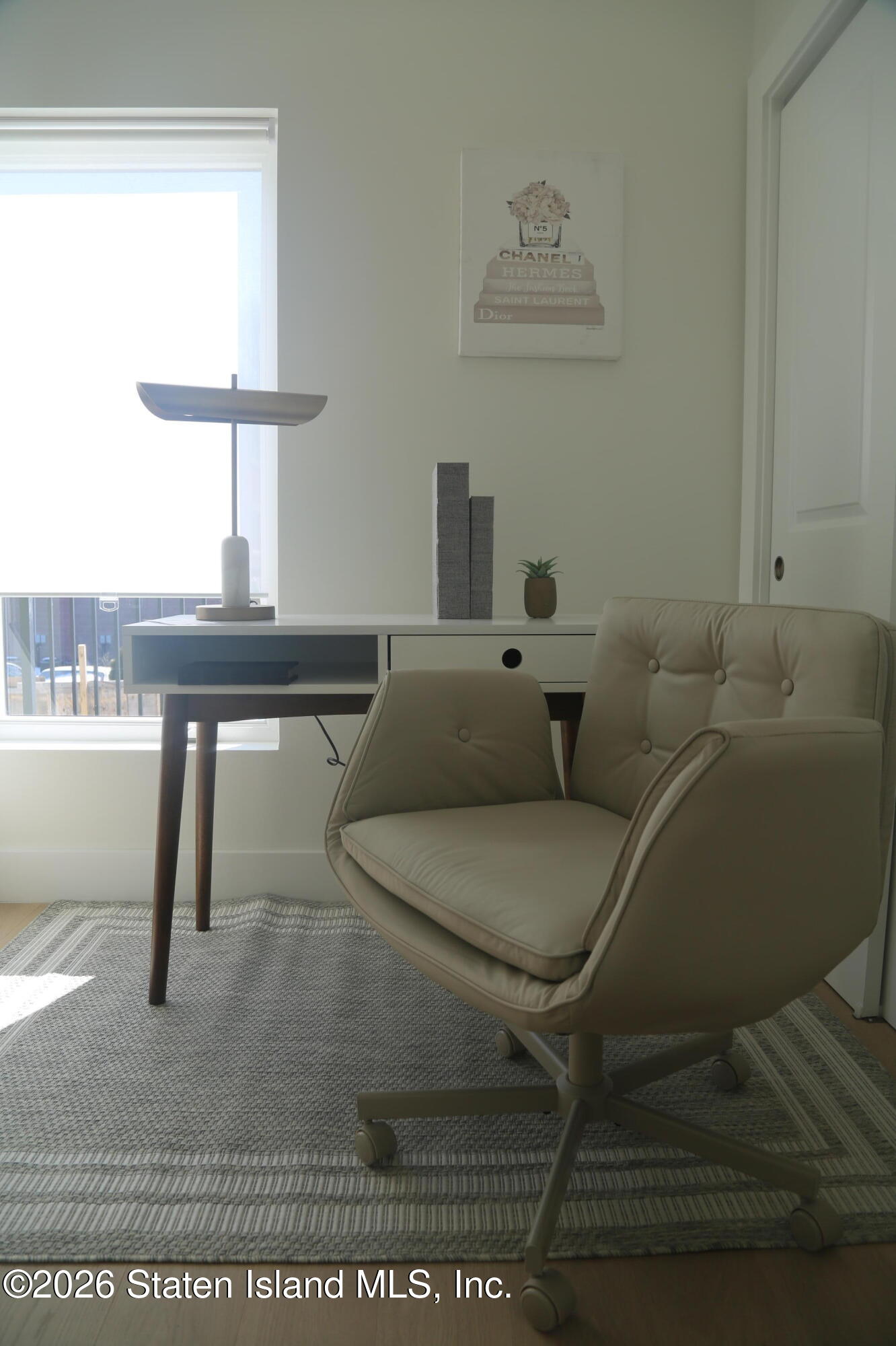 1239 Forest Hill Road, Unit 21 Staten Island, NY 10314 - Photo 13 of 15 a living room with furniture a window and a table