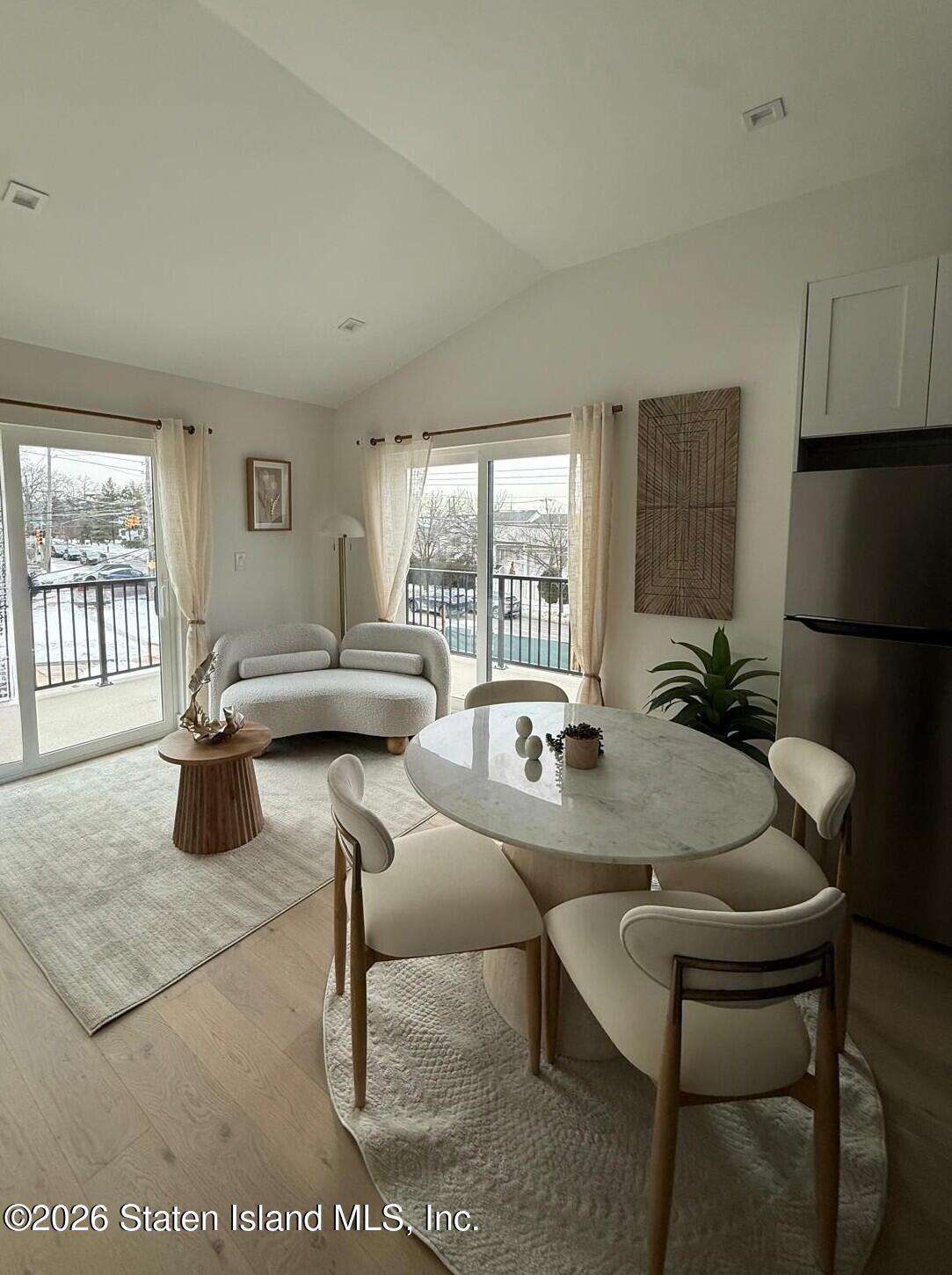 1239 Forest Hill Road, Unit 21 Staten Island, NY 10314 - Photo 4 of 15 a view of a dining room with furniture