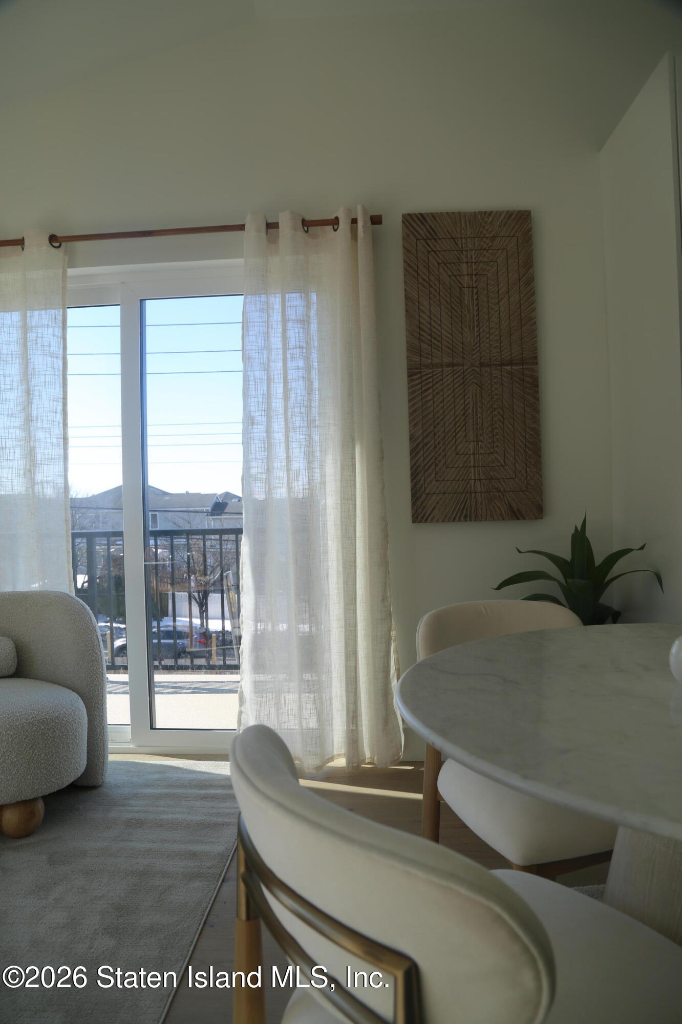 1239 Forest Hill Road, Unit 21 Staten Island, NY 10314 - Photo 5 of 15 a living room with furniture and a window