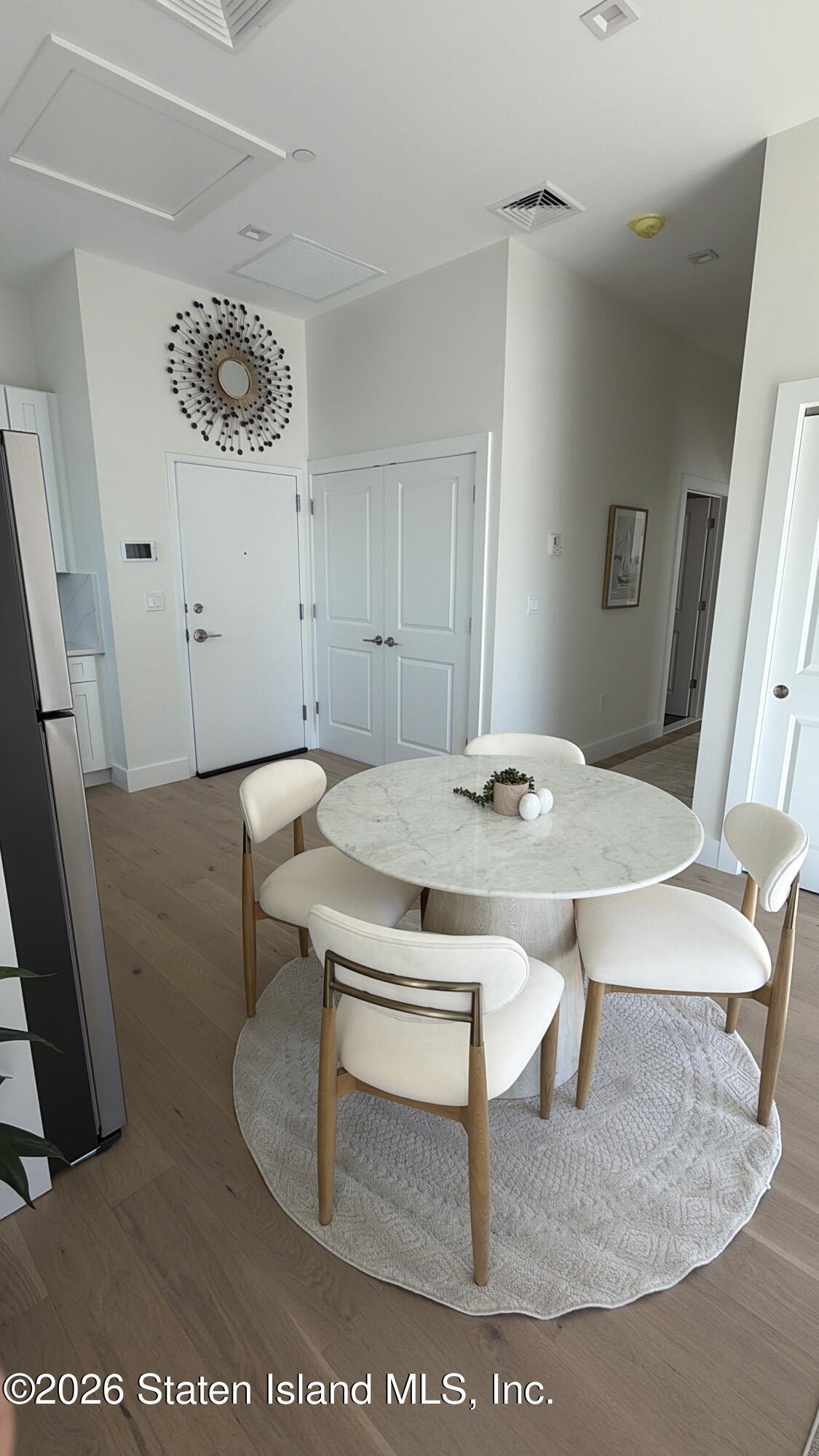 1239 Forest Hill Road, Unit 21 Staten Island, NY 10314 - Photo 8 of 15 a view of a dining room with furniture