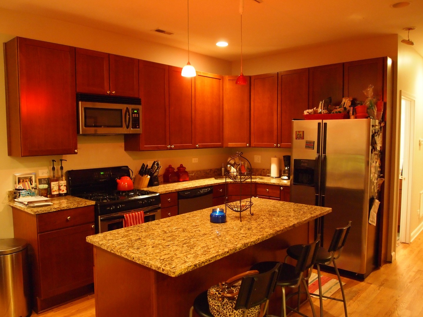 1330 West Roscoe Street, Unit 2 Chicago, IL 60657 - Photo 2 of 11 a kitchen with a sink refrigerator and microwave