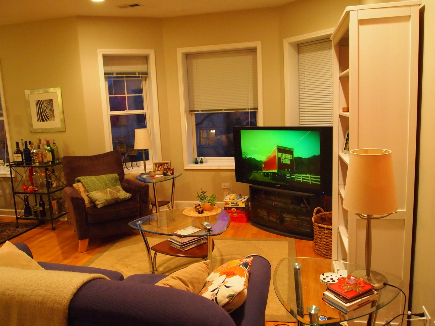 1330 West Roscoe Street, Unit 2 Chicago, IL 60657 - Photo 4 of 11 a living room with furniture a flat screen tv and a fireplace