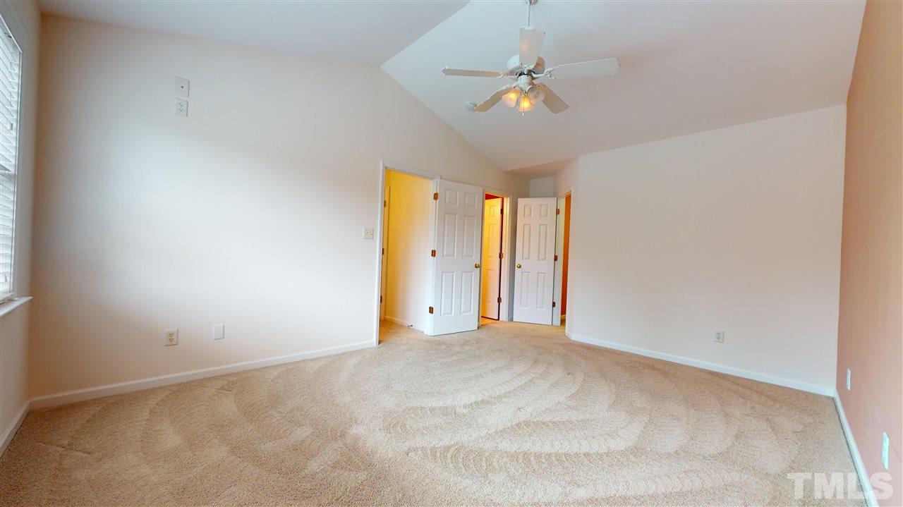 4840 Topstone Road Raleigh, NC 27603 - Photo 20 of 30 a view of an empty room with a chandelier fan