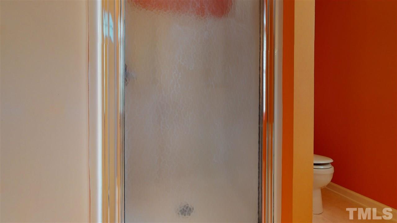 4840 Topstone Road Raleigh, NC 27603 - Photo 22 of 30 a view of a bathroom from a hallway